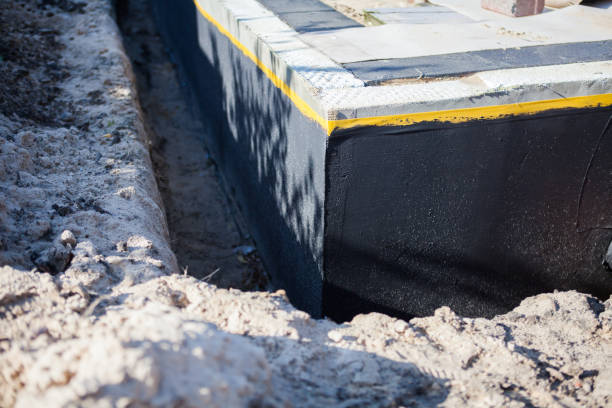 Professional Waterproofing technician working in Bridgeport, OH